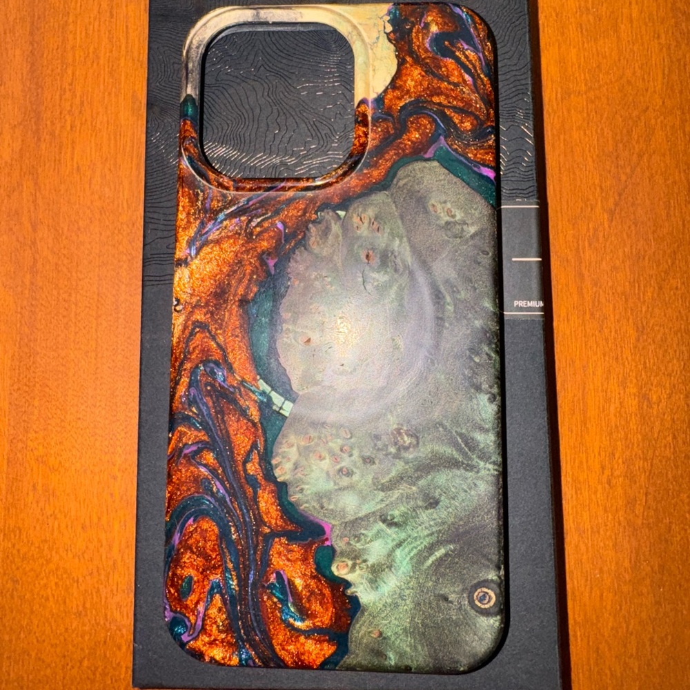 Carved live edge 15 pro max iphone case made of wood and resin.